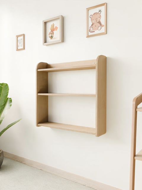 Empty Montessori wall-mounted shelf made of birch plywood, perfect for organizing toys, books, and decorations in a minimalist nursery.