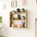 Montessori wall-mounted shelf in a nursery, holding toys, plants, and art supplies, with a minimalist and natural design.